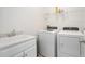 Laundry room with washer, dryer, and utility sink at 7518 Sw 77Th Ave, Ocala, FL 34481