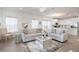 Living room with two sofas and view into kitchen at 7518 Sw 77Th Ave, Ocala, FL 34481