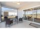 Relaxing screened patio with seating area and view of backyard at 7518 Sw 77Th Ave, Ocala, FL 34481