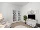 Sitting room with French doors, armchairs, and a media console at 7518 Sw 77Th Ave, Ocala, FL 34481