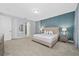 Bright bedroom with patterned wall, large bed, and plenty of light at 7668 Fairfax Dr, Kissimmee, FL 34747