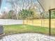 Landscaped backyard with a patio and wooden fence at 925 Mill Road Ln, Port Orange, FL 32127