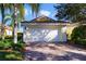 White garage door with brick paver driveway at 12079 Modena Ln, Orlando, FL 32827