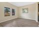 Bright room with natural light, wood-look flooring, and neutral paint at 12269 Great Commission Way, Orlando, FL 32832