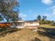 Large backyard with screened porch and fire pit at 1319 N Old Mill Dr, Deltona, FL 32725