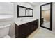 Updated bathroom with double vanity and large mirror at 1319 N Old Mill Dr, Deltona, FL 32725