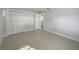 Bright bedroom with neutral walls and large closet at 1319 N Old Mill Dr, Deltona, FL 32725