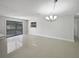 Spacious dining room with tile floors and large window at 1319 N Old Mill Dr, Deltona, FL 32725