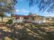 House exterior with screened porch and solar panels at 1319 N Old Mill Dr, Deltona, FL 32725