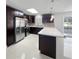 Modern kitchen with stainless steel appliances and white countertops at 1319 N Old Mill Dr, Deltona, FL 32725