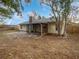 Spacious backyard with a screened-in patio at 1350 Bailey Ave, Deltona, FL 32725