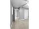 Simple bedroom with tile floors and neutral walls at 1350 Bailey Ave, Deltona, FL 32725