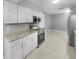 Modern kitchen with white cabinets and granite countertops at 1350 Bailey Ave, Deltona, FL 32725