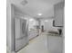 Modern kitchen with stainless steel appliances and granite countertops at 1350 Bailey Ave, Deltona, FL 32725