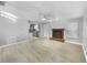 Open living room with a fireplace and kitchen view at 1350 Bailey Ave, Deltona, FL 32725