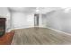 Living room with brick fireplace and wood-look floors at 1350 Bailey Ave, Deltona, FL 32725