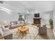 Bright living room featuring a fireplace and comfortable seating at 1350 Bailey Ave, Deltona, FL 32725
