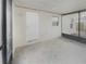 Bright, screened porch with white door and view of backyard at 1350 Bailey Ave, Deltona, FL 32725
