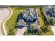 Sprawling two-story home with lush landscaping and a paved driveway with a fountain at 14039 Hampshire Bay Cir, Winter Garden, FL 34787