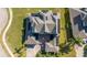 Two-story house, solar panels on roof, aerial view at 14039 Hampshire Bay Cir, Winter Garden, FL 34787