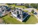 Two-story house with solar panels on the roof and a large backyard at 14039 Hampshire Bay Cir, Winter Garden, FL 34787