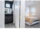 Modern bathroom with dark vanity and LED mirror at 14039 Hampshire Bay Cir, Winter Garden, FL 34787