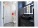Contemporary bathroom with dark accents and sleek fixtures at 14039 Hampshire Bay Cir, Winter Garden, FL 34787