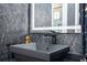 Modern bathroom with dark vanity and sleek fixtures at 14039 Hampshire Bay Cir, Winter Garden, FL 34787