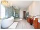 Elegant bathroom featuring a large soaking tub, walk-in shower, and modern vanity at 14039 Hampshire Bay Cir, Winter Garden, FL 34787
