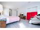 Large bedroom with king-size bed, massage chair, and access to exterior at 14039 Hampshire Bay Cir, Winter Garden, FL 34787