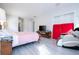 Large bedroom with king-size bed, massage chair, and access to exterior at 14039 Hampshire Bay Cir, Winter Garden, FL 34787