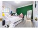 Bright bedroom with a desk and full-length mirror at 14039 Hampshire Bay Cir, Winter Garden, FL 34787