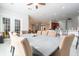 Open concept dining room with seating for eight and access to kitchen at 14039 Hampshire Bay Cir, Winter Garden, FL 34787