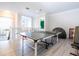 Upper-level game room features a ping pong table and plenty of space for entertainment at 14039 Hampshire Bay Cir, Winter Garden, FL 34787
