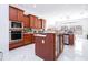 Modern kitchen with stainless steel appliances and center island at 14039 Hampshire Bay Cir, Winter Garden, FL 34787