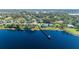 Aerial view showcasing lakefront property and a private dock at 14039 Hampshire Bay Cir, Winter Garden, FL 34787