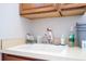 Laundry room with utility sink and storage at 14039 Hampshire Bay Cir, Winter Garden, FL 34787