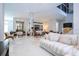 Bright and airy living room with ample seating and large windows at 14039 Hampshire Bay Cir, Winter Garden, FL 34787