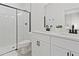 Modern bathroom features double vanity, black hardware, a large walk-in shower with glass enclosure at 14735 Sw 69Th Court Rd, Ocala, FL 34473