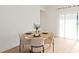 Cozy dining area with a round wooden table, stylish chairs, and natural light at 14735 Sw 69Th Court Rd, Ocala, FL 34473