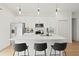 Modern kitchen featuring stainless steel appliances, a center island, and white cabinetry at 14735 Sw 69Th Court Rd, Ocala, FL 34473