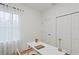 Bright home office features a large window, wood floors, a closet, and modern desk at 14735 Sw 69Th Court Rd, Ocala, FL 34473