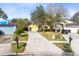 House with driveway and surrounding houses visible at 14850 Lady Victoria Blvd, Orlando, FL 32826