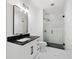 Stylish bathroom with marble shower and black vanity at 150 E Robinson St # 2908, Orlando, FL 32801