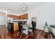 Elegant dining area with glass table and hardwood floors at 150 E Robinson St # 2908, Orlando, FL 32801
