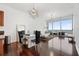 Bright living room with hardwood floors and city views at 150 E Robinson St # 2908, Orlando, FL 32801