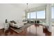 Living room with city views and hardwood floors at 150 E Robinson St # 2908, Orlando, FL 32801