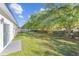 Spacious backyard with grassy area and wooden fence at 162 Nw 42Nd Pl, Ocala, FL 34475