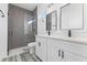 Modern bathroom with double vanity and walk-in shower at 162 Nw 42Nd Pl, Ocala, FL 34475