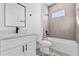 Clean bathroom with white vanity, grey tile, and a bathtub at 162 Nw 42Nd Pl, Ocala, FL 34475